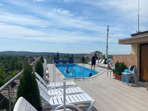 a balcony with a swimming pool on top of a building at Fantasy Apartment 15 комплекс Фантазия, Хисаря in Hisarya