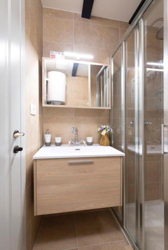 a bathroom with a sink and a shower at Vanilla in Izola