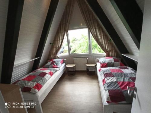 Katil atau katil-katil dalam bilik di Ferienpark Fedderwardersiel