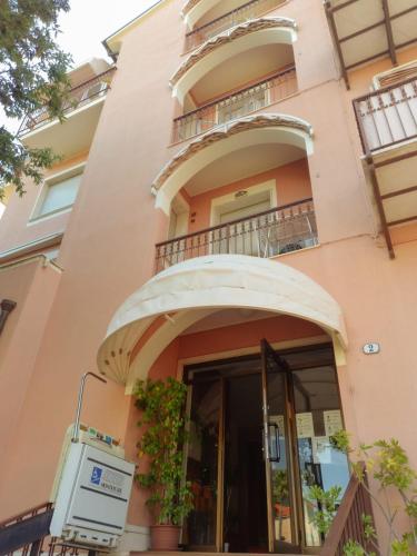 a building with a balcony and a door at Residence Cherie in Borgio Verezzi