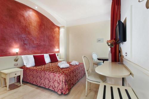 Säng eller sängar i ett rum på Hotel Spiaggia