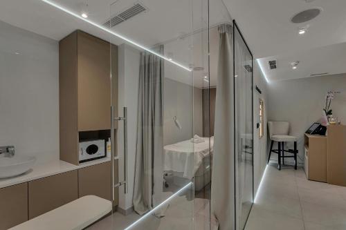 a bathroom with a shower and a sink at Boutique Hotel Noemia in Baška Voda