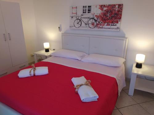Postel nebo postele na pokoji v ubytování CASA VACANZE I MORI