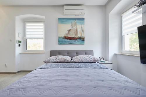 Ein Bett oder Betten in einem Zimmer der Unterkunft Apartments and Rooms Mišić