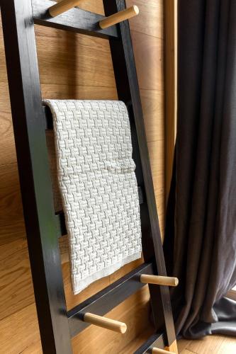 a white towel on a shelf in a room at Hiša Križaj in Bohinj