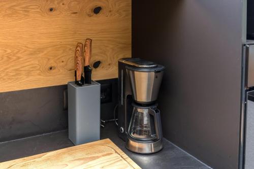 a coffeemaker sitting on top of a kitchen counter at Hiša Križaj in Bohinj
