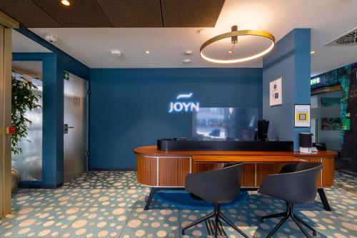 De lobby of receptie bij JOYN Cologne - Serviced Apartments