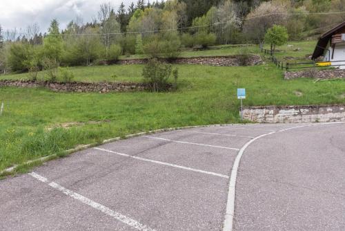 an empty parking lot next to a field at Casa Sicina Alberto in Valfloriana