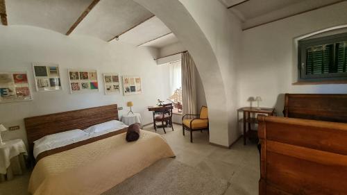 a bedroom with a bed and a table in it at Bella di Ceciliano in Arezzo