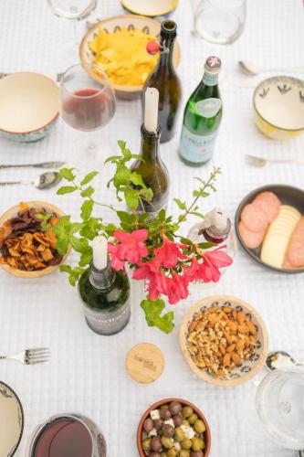a table topped with food and bottles of wine at Forty Winks Loch Lomond in Balloch