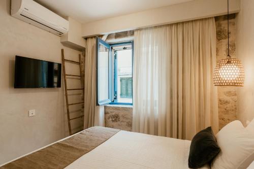 Katil atau katil-katil dalam bilik di BOĒM Boutique Hotel Lefkada