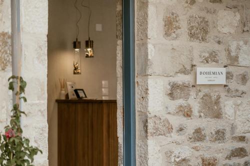 a brick wall with a sign that reads durham at Bohèmian Boutique Hotel Lefkada in Lefkada Town