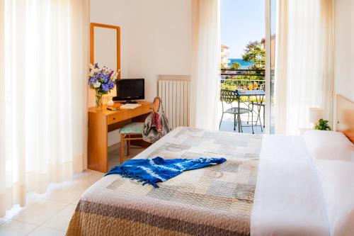 Giường trong phòng chung tại Hotel Virginia