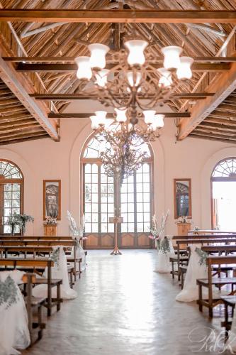 a wedding hall with tables and chairs and a chandelier at Kleinkaap Boutique Hotel in Centurion