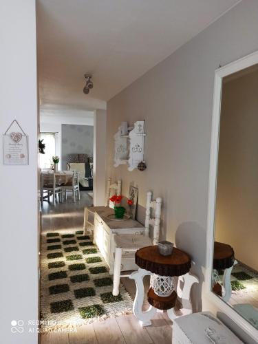 a living room with a table and a dining room at Casa Lucia in Dămuc