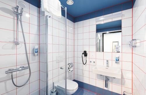 Koupelna v ubytování MEININGER Hotel Genève Centre Charmilles