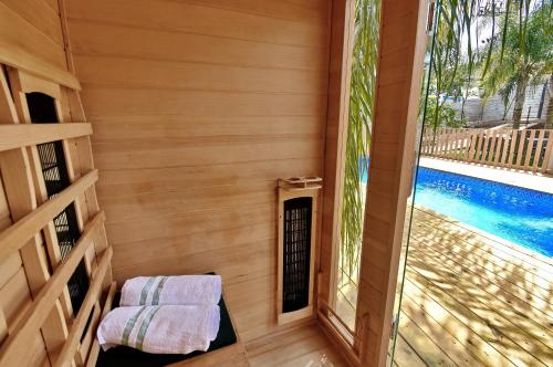 a small room with a window and a swimming pool at וילה גאיה בכנרת-VIILA GAYA in Migdal