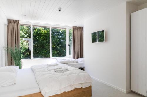 Katil atau katil-katil dalam bilik di Duinappartementen Schoorl