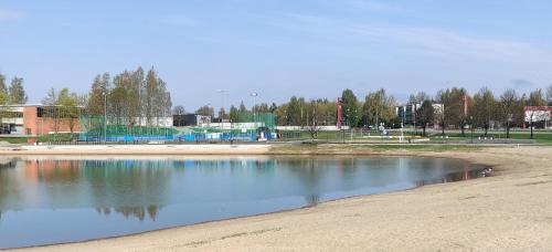 a pool of water in the middle of a park at Nina`s GuestHouse, Jämsä City, 160 m2, Include x2 Himos Ski Pass in Jämsä