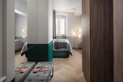 Säng eller sängar i ett rum på Borgo Apartment