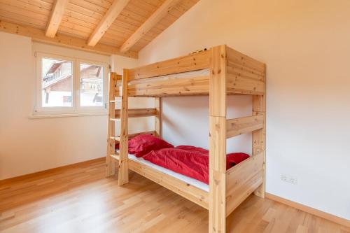 Una cama o camas en una habitación de Ferienhaus Sigelalp
