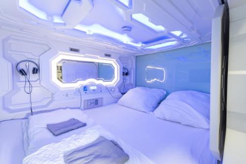 Ένα ή περισσότερα κρεβάτια σε δωμάτιο στο Space Home Apartment - Inner City