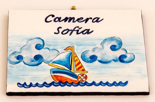 a sign with a sail boat in the water at il Riccio B&B in Ortona