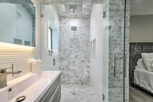a bathroom with a sink and a shower at Upscale Home with Hot Tub Walk to Pompano Beach! in Pompano Beach