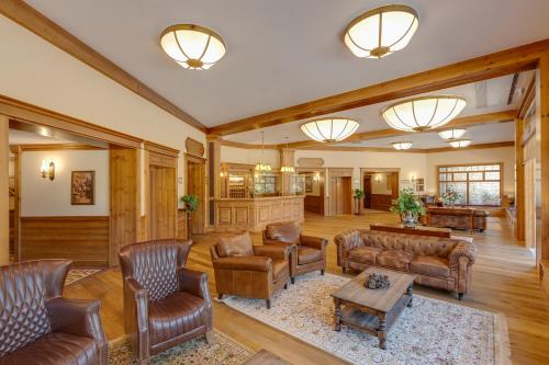 a large living room with leather furniture and wooden floors at PortAventura Hotel Colorado Creek - Includes unlimited access to PortAventura Park & 1 access to Ferrari Land in Salou
