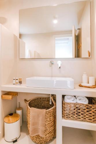 a bathroom with a sink and a mirror at Casa Eutopia in Agios Romanos