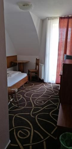 Postel nebo postele na pokoji v ubytování Pension Magnolia