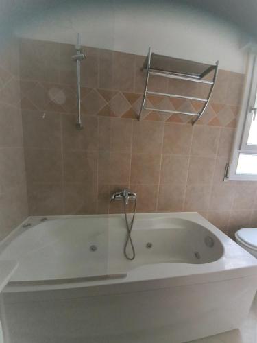 a white bath tub in a bathroom with a toilet at B&B Airone Cervia - Camere e Appartamenti in Cervia