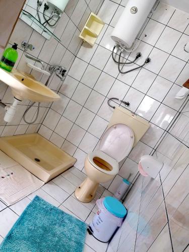 a bathroom with a toilet and a sink at The Blue Pearl in Prinos