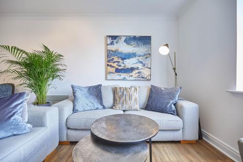 a living room with a couch and a table at Host & Stay - Freshwater View in Whitby