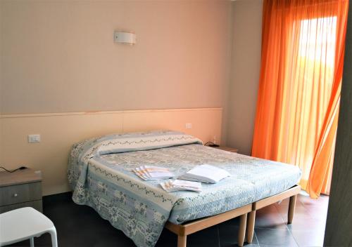 Postel nebo postele na pokoji v ubytování Le Vele Residence