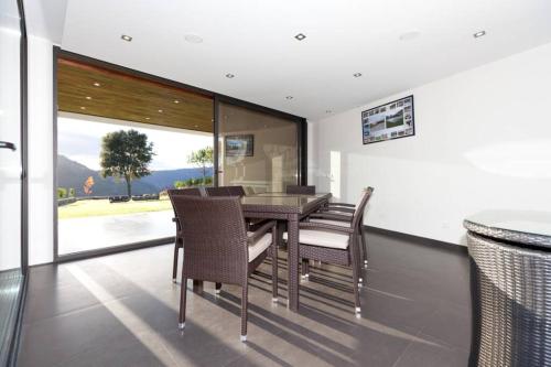 a dining room with a table and some chairs at Casa de Louredo-Gerês in Vieira do Minho