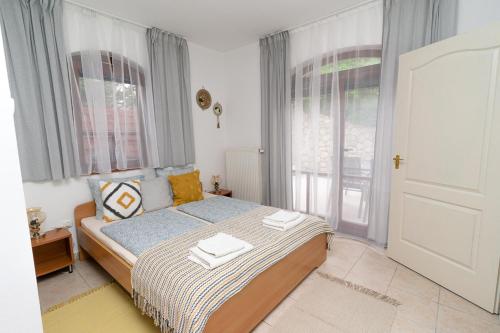 Postel nebo postele na pokoji v ubytování Villa Renata