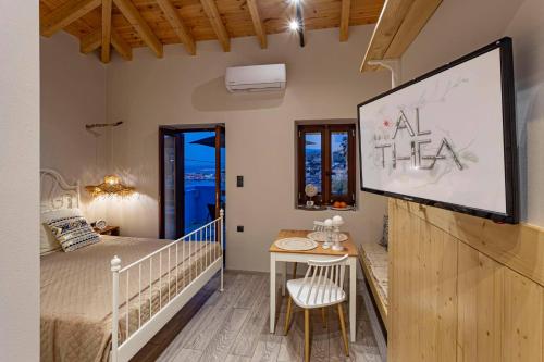A bed or beds in a room at Althea Apartments 2