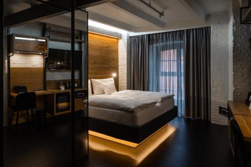 Postel nebo postele na pokoji v ubytování GINN Hotel Hamburg Elbspeicher