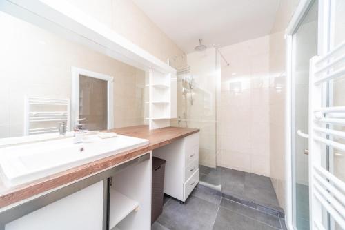 a bathroom with a sink and a mirror at Resort Bevilacqua in Budva