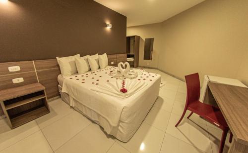 Ένα ή περισσότερα κρεβάτια σε δωμάτιο στο Safira Praia Hotel