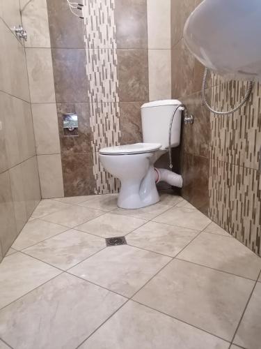 a bathroom with a toilet and a sink at Megi Apartments, Nesebar sity in Nesebar