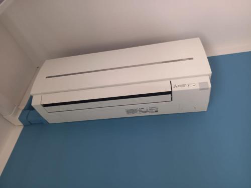 a white printer sitting on top of a ceiling at FLY HOUSE BOLOGNA...un appartamento al volo in Bologna