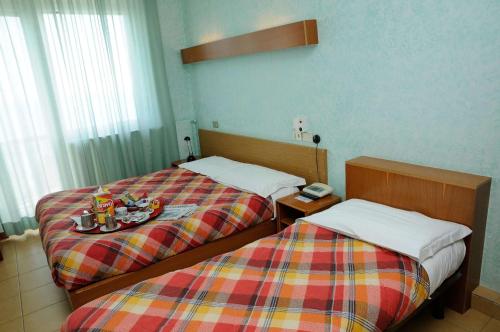 Una cama o camas en una habitación de Hotel Puntabella
