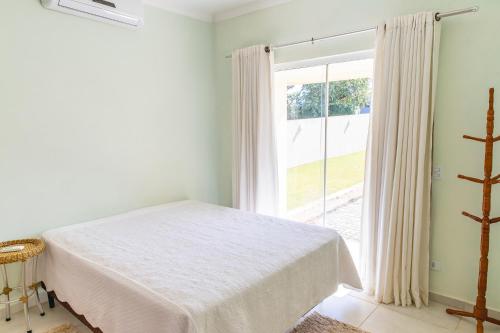 Postel nebo postele na pokoji v ubytování Casa com Wi-Fi e lazer completo em Carlopolis PR