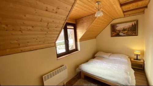 Postel nebo postele na pokoji v ubytování Apartamenty Pod Skałą