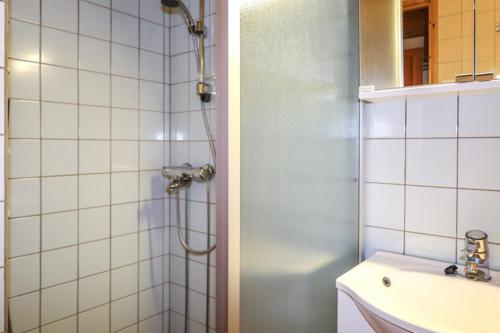 a bathroom with a shower and a sink at Syöte Luppomaja in Syöte