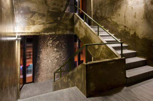 a set of stairs in an old building at Vitoria Stone Hotel in Évora