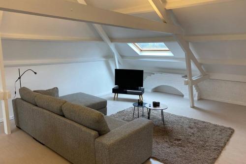 Seating area sa Moderne loft in historisch pand