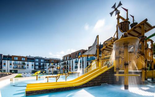 a water park with a slide and a water slide slide at Bel Mare II 428 in Międzyzdroje